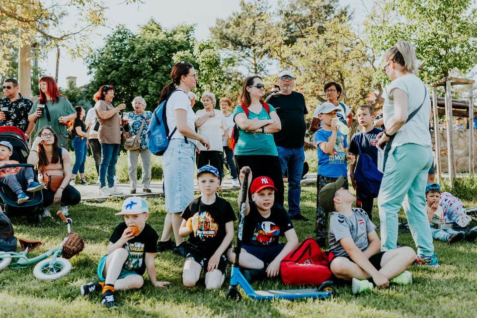 Children and adults gathered outdoors at a community event
